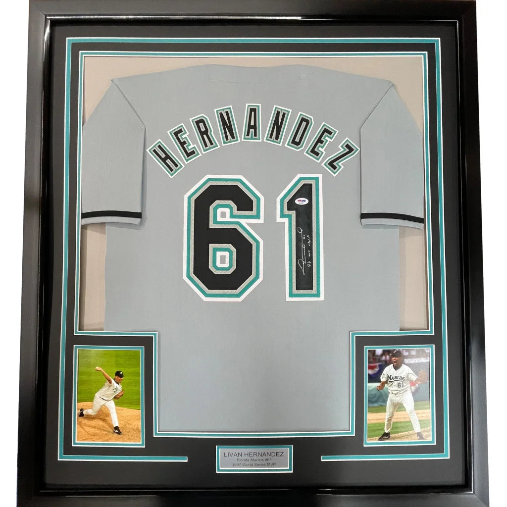 Gray Florida baseball jersey signed by Livan Hernandez with black and teal hernandez 61 on the back framed 35x39 inches