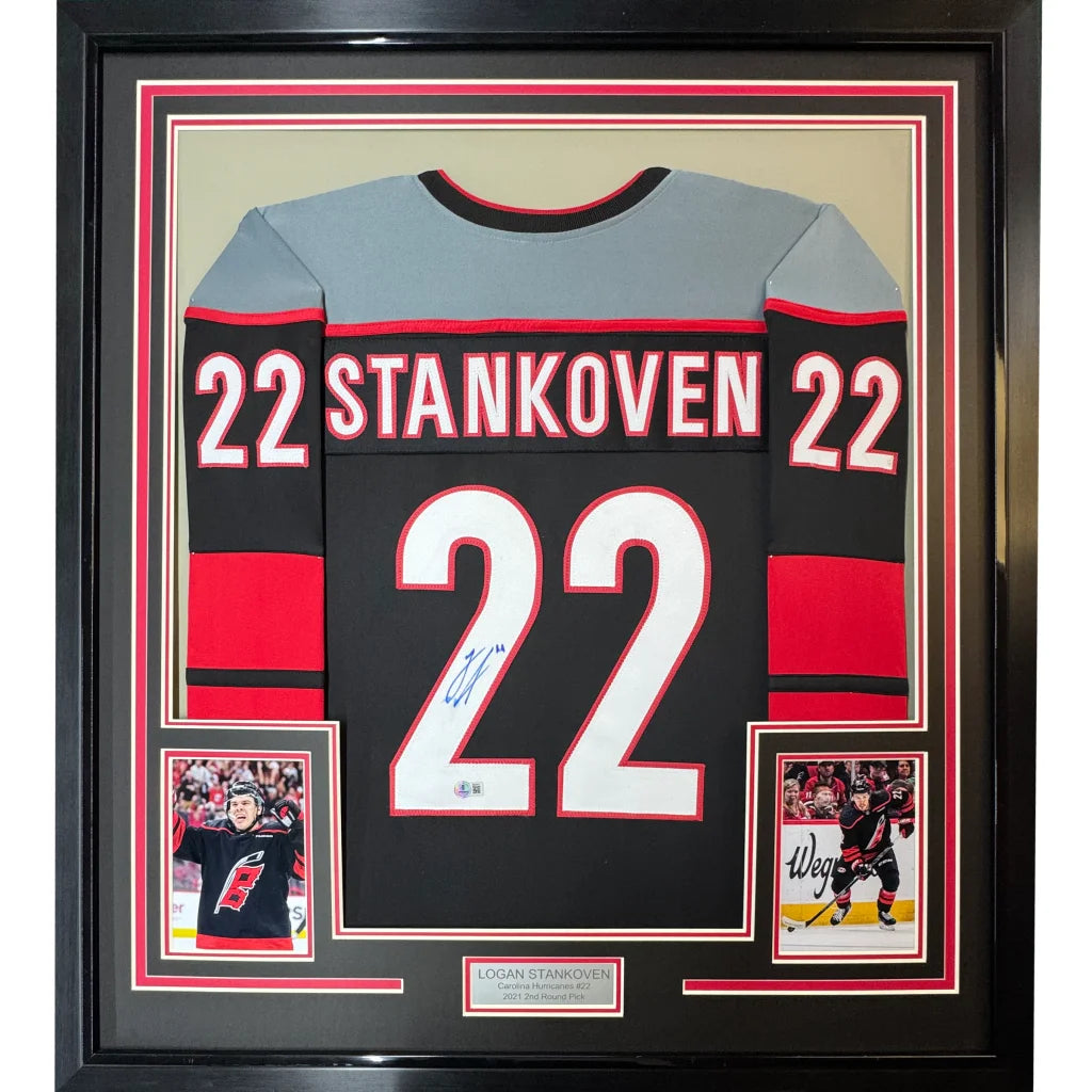 Framed autographed Logan Stankoven black red Carolina hockey jersey 22