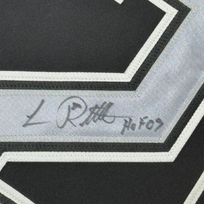 Framed autographed Luc Robitaille HOF 09 black hockey jersey with silver scarf