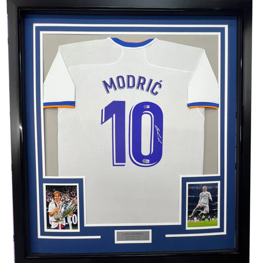 Framed white football jersey with MODRIĆ 10 on the back ready for display