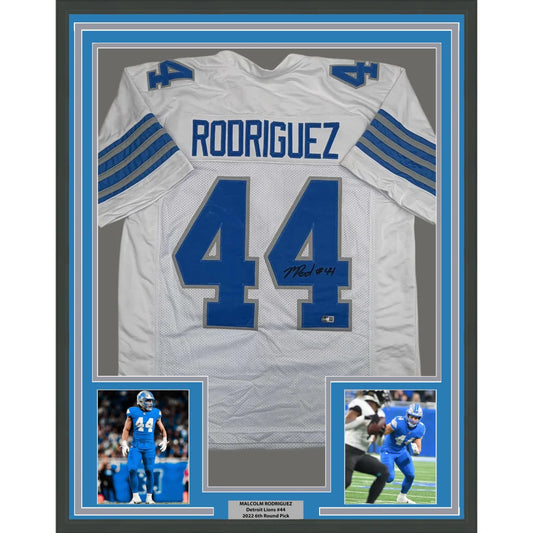 Framed Autographed Malcolm Rodriguez 35x39 Detroit White Football Jersey Beckett BAS COA | Hall of Fame Sports Memorabilia | vintageantiquesgifts.com