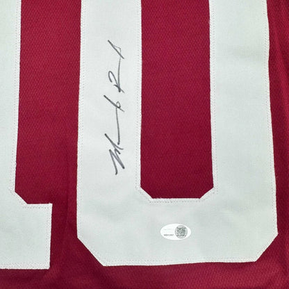 Back of framed autographed Marcel Reed Texas A&M maroon jersey with number 10