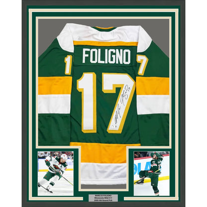 Green and yellow minnesota wild hockey jersey with white accents showing the back side with foligno 17 on the framed autograph