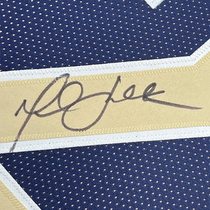 Framed Autographed Marshall Faulk 35x39 St. Louis Navy Blue Football Jersey Beckett BAS COA | Certified Authentic Signed Memorabilia | vintageantiquesgifts.com