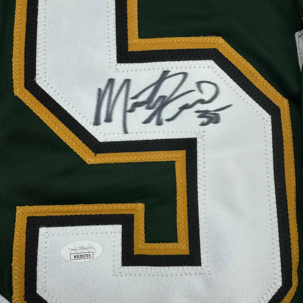 Professionally framed Dallas Stars green hockey jersey with autograph and authentication sticker