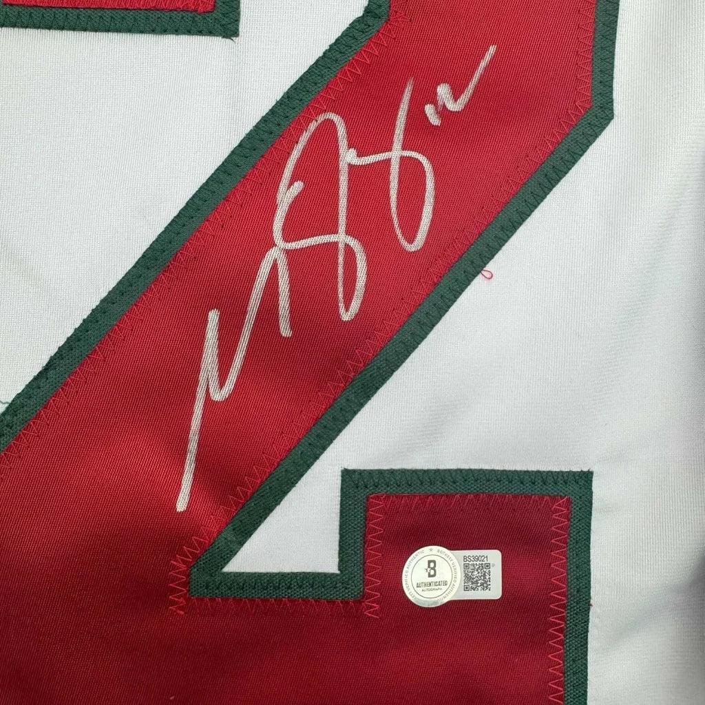 White hockey jersey with Matt Boldy autograph and Beckett BAS COA frame