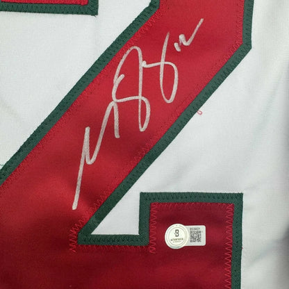 White hockey jersey with Matt Boldy autograph and Beckett BAS COA frame