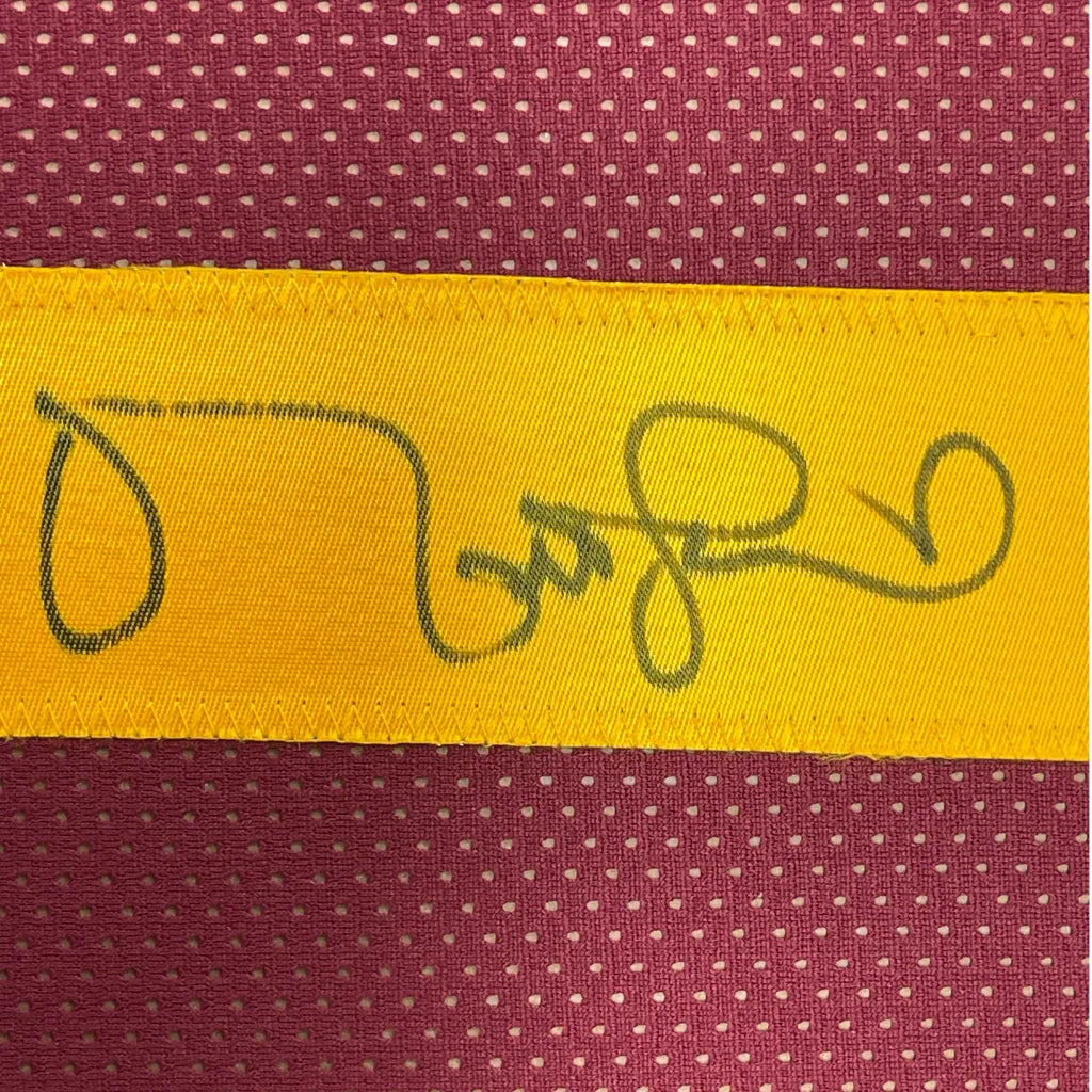 Vibrant yellow label with stitched Matt Leinart signature on USC red jersey
