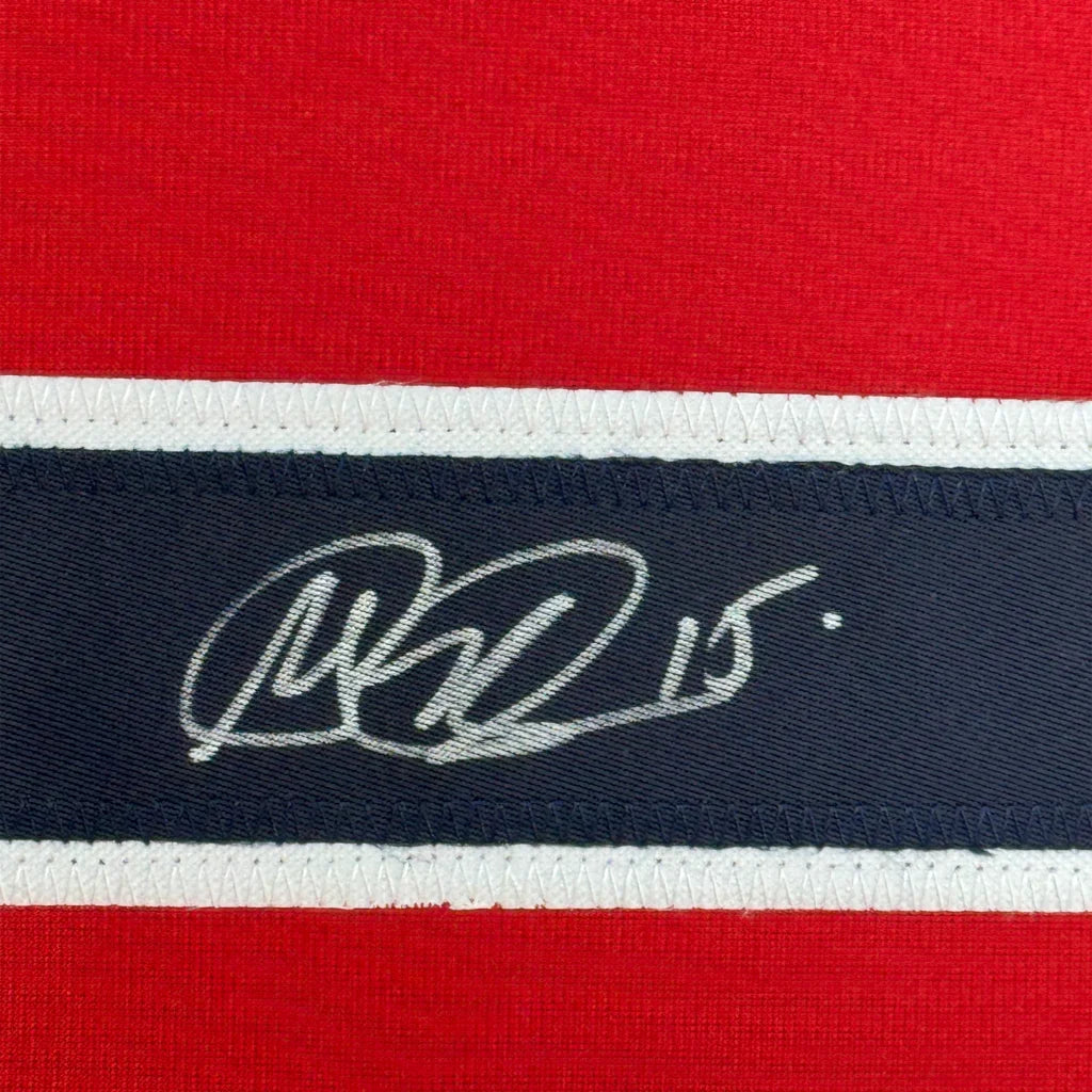Red and navy blue striped USWNT jersey with white autograph, perfect for framing