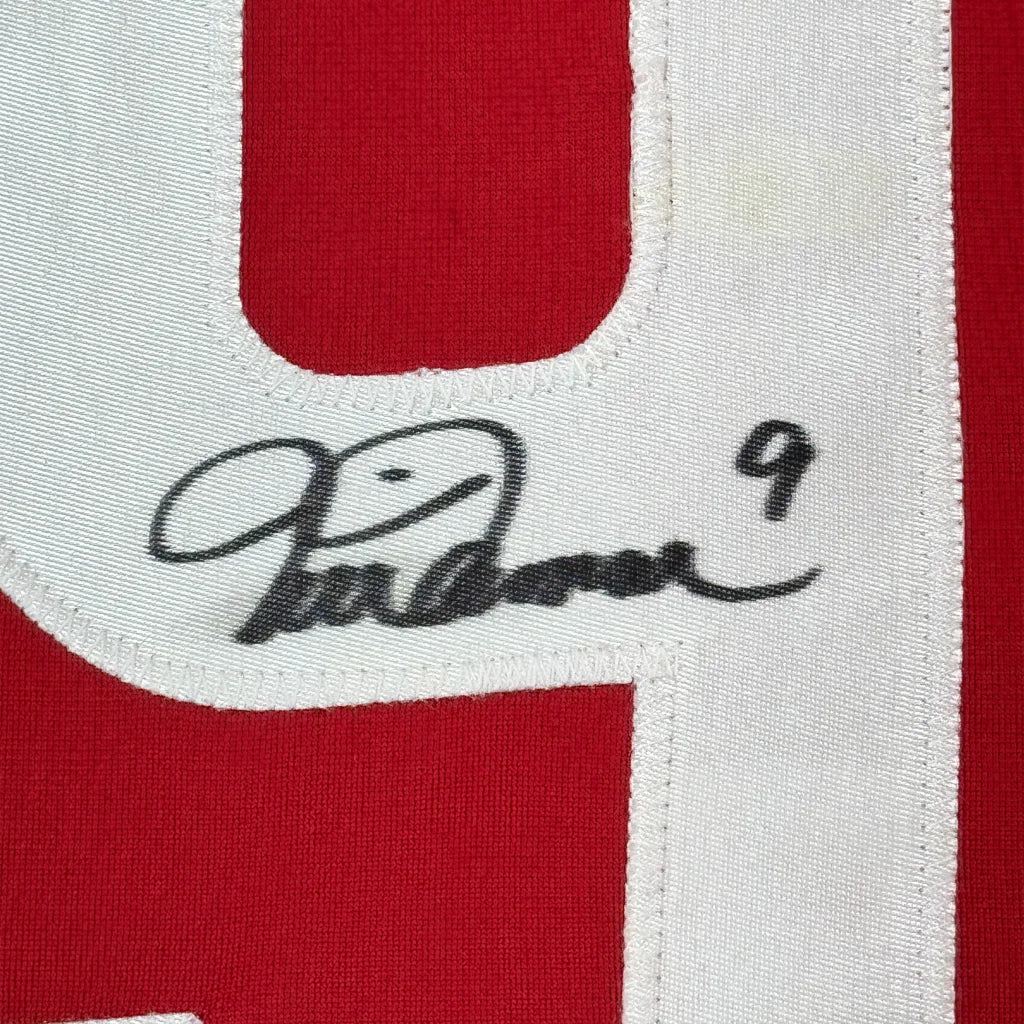 Red Mia Hamm signed soccer jersey with white number 9 and autograph ready for display