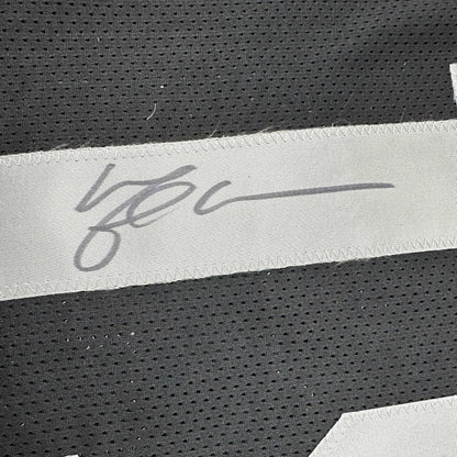 Framed autographed Michael Crabtree Oakland Raiders black jersey with gray signature