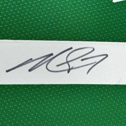 Green perforated fabric with white strip and signature on professionally framed Michael Vick Eagles Jersey