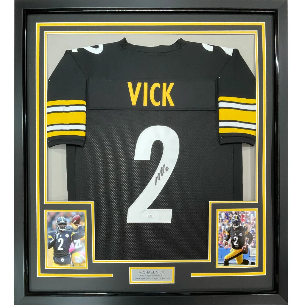 Framed Michael Vick Steelers jersey with autograph and photos on display
