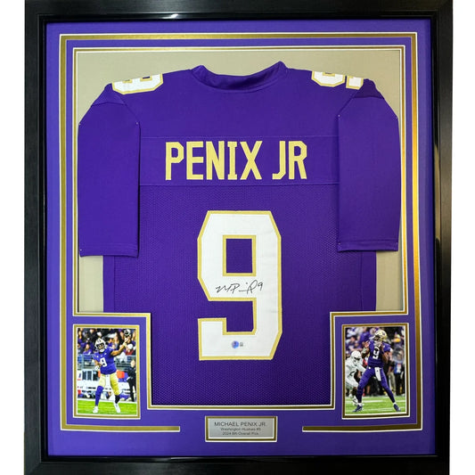 Back view of a purple washington huskies college football jersey with gold lettering signed by michael penix jr framed 35x39