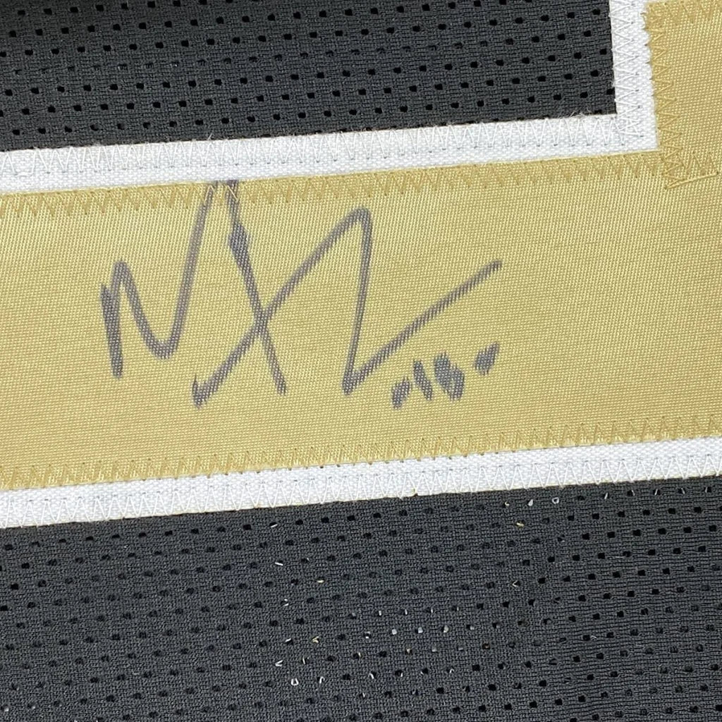 Framed autographed Michael Thomas New Orleans Saints jersey with gold signature patch