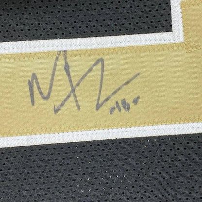 Framed autographed Michael Thomas New Orleans Saints jersey with gold signature patch