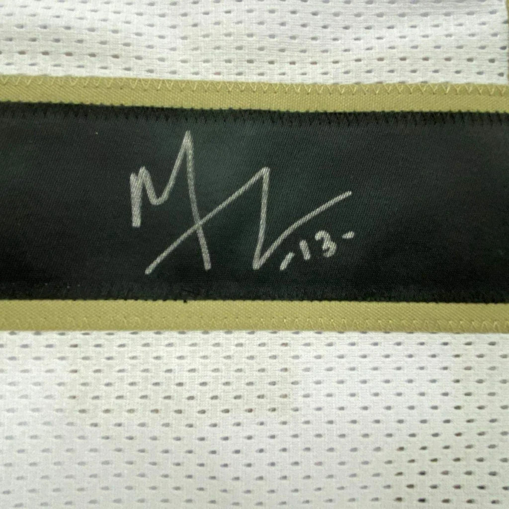 Framed autographed Michael Thomas white Saints jersey with JSA COA