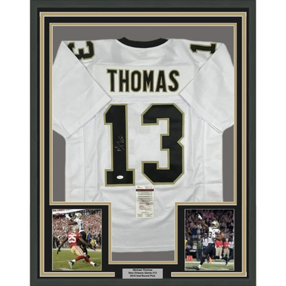 Framed autographed Michael Thomas white New Orleans Saints jersey with name Thomas and number 13, JSA COA
