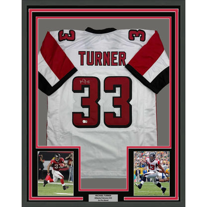 Framed Autographed Michael Turner 35x39 Atlanta White Football Jersey Beckett BAS COA | Hall of Fame Sports Memorabilia | vintageantiquesgifts.com