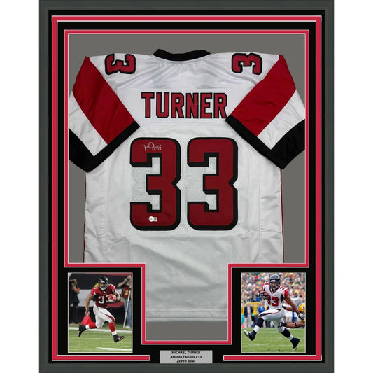 Framed Autographed Michael Turner 35x39 Atlanta White Football Jersey Beckett BAS COA | Hall of Fame Sports Memorabilia | vintageantiquesgifts.com