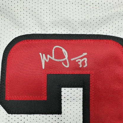 Framed Autographed Michael Turner 35x39 Atlanta White Football Jersey Beckett BAS COA | Certified Authentic Signed Memorabilia | vintageantiquesgifts.com