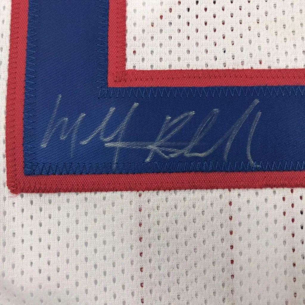 Framed autographed michael ray richardson white mesh basketball jersey with blue and red trim and silver stitched signature