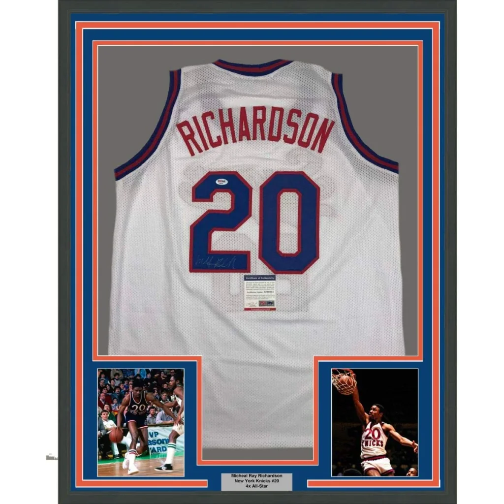 White mesh basketball jersey with red and blue lettering signed by michael ray richardson featuring number 20 on back
