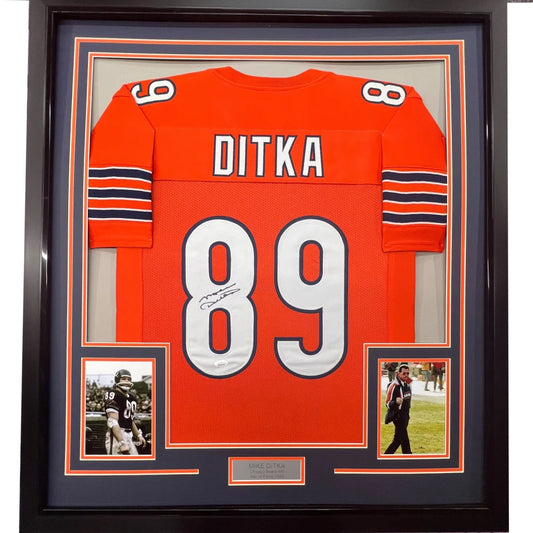 Framed autographed Mike Ditka orange Chicago Bears jersey back, number 89 Ditka