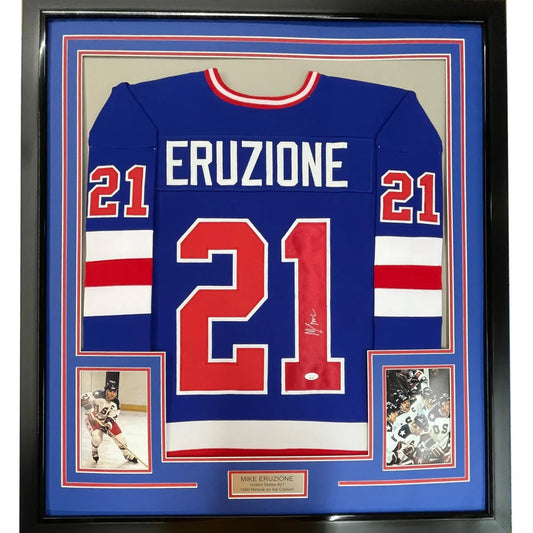 Back of a framed autographed mike eruzi blue and red 1980 miracle on ice united states hockey jersey with name and number 21