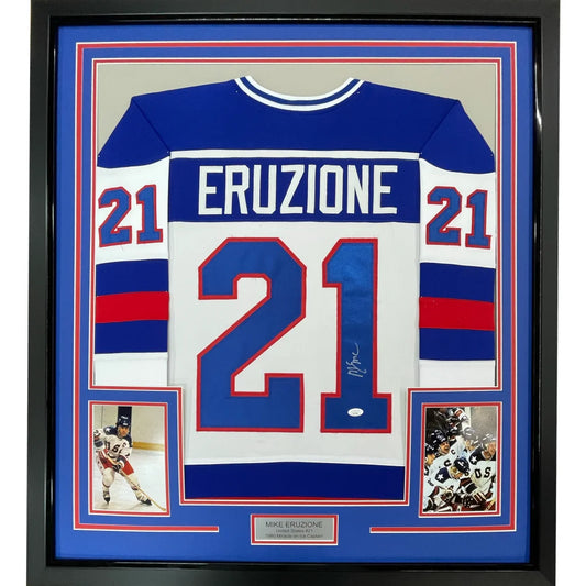 Framed autographed mike eruziu blue and white hockey jersey with red accents in black border 35x39 inches