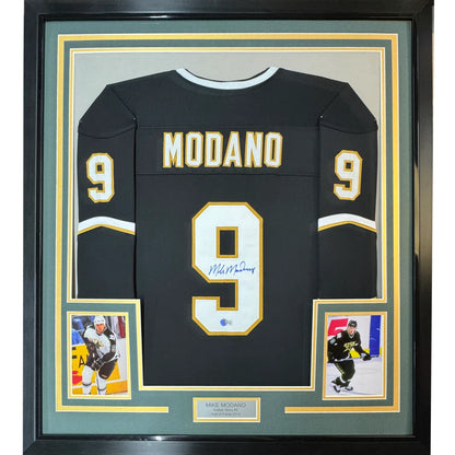 Framed autographed black hockey jersey with gold numbers and lettering from Championship collection