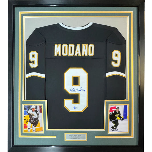 Framed autographed black hockey jersey with gold numbers and lettering from Championship collection