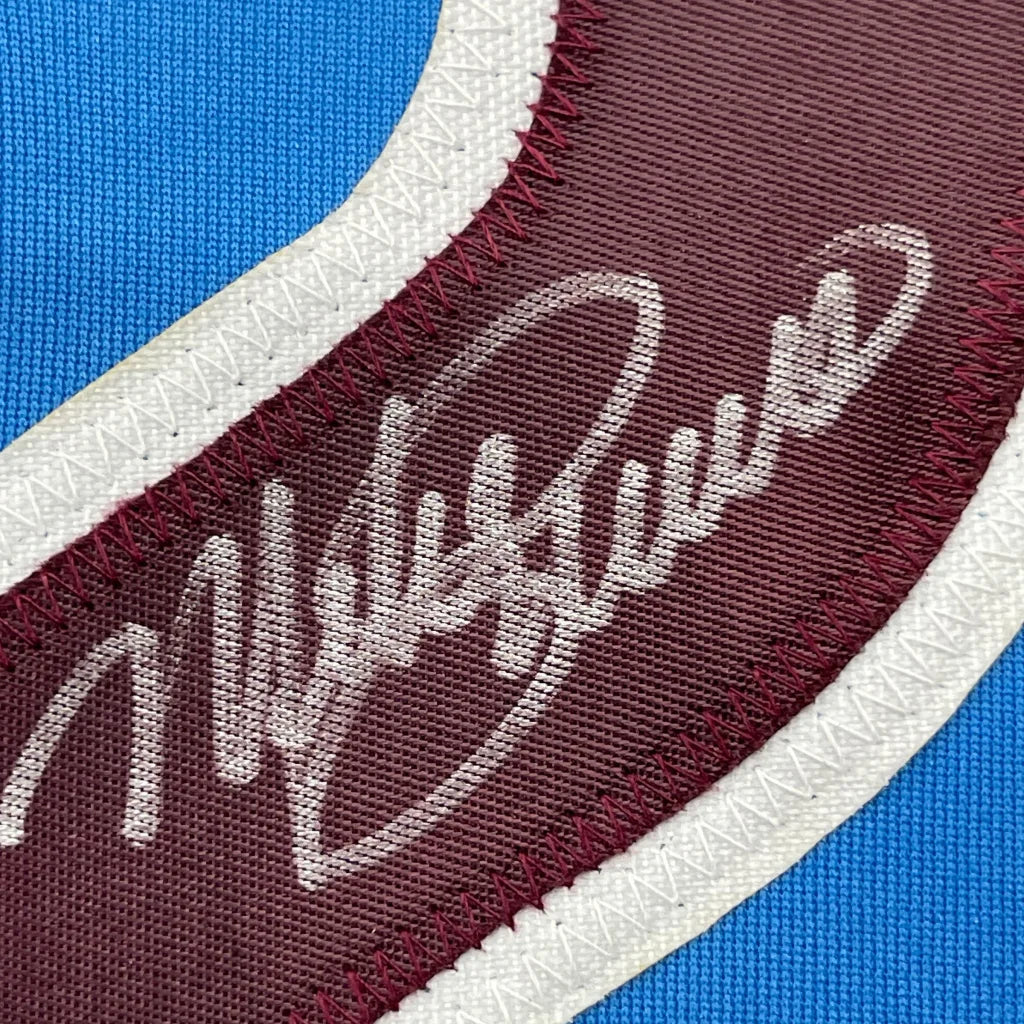 Maroon and white embroidered Mike Schmidt signature on framed Philadelphia Phillies retro blue jersey