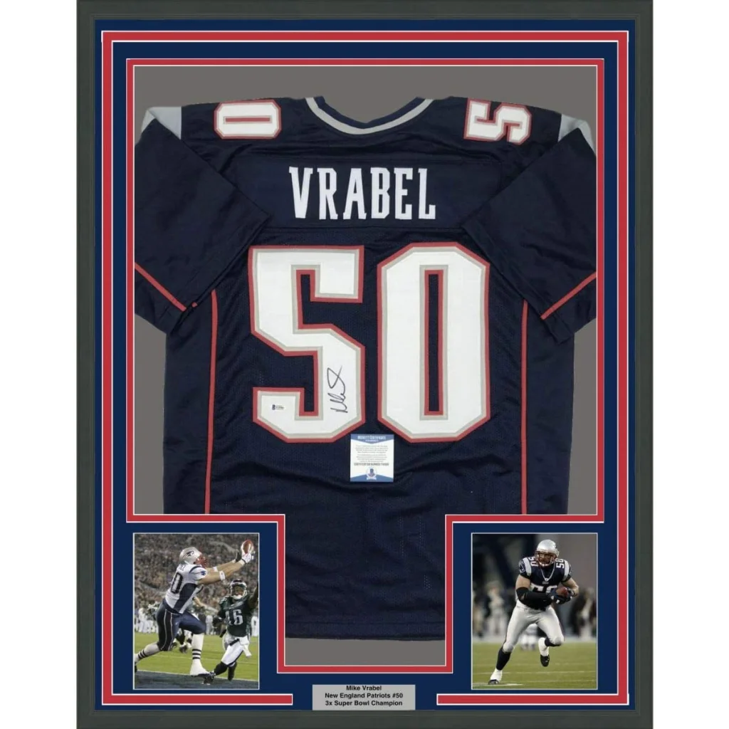Framed autographed navy blue new england patriots mike vrabel jersey with white and red lettering signed by player