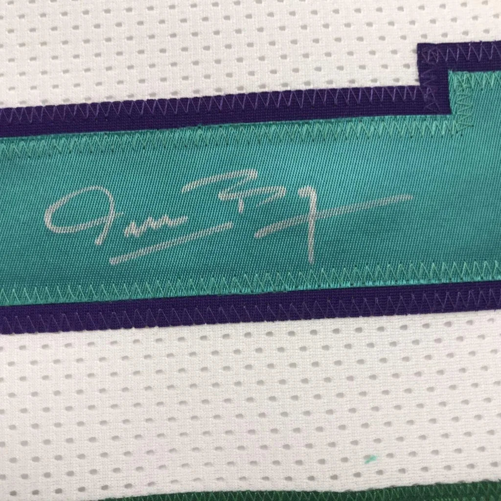 Framed autographed Muggsy Bogues Charlotte white basketball jersey with teal and purple signature stripe on white mesh, PSA/DNA COA