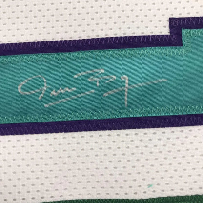 Framed autographed Muggsy Bogues Charlotte white basketball jersey with teal and purple signature stripe on white mesh, PSA/DNA COA