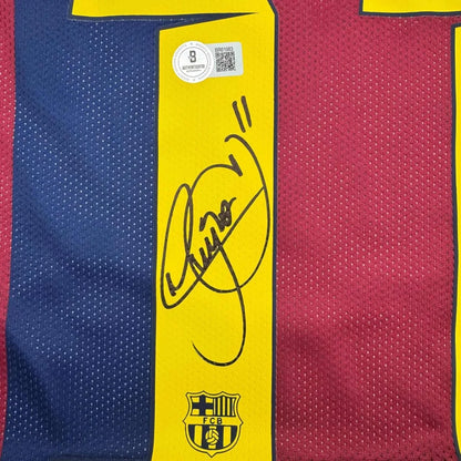 Autographed Barcelona football jersey with Neymar Jr signature and action photos in frame