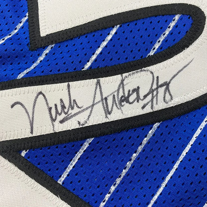 Framed autographed Nick Anderson Orlando blue pinstripe basketball jersey with black trim and signature across chest