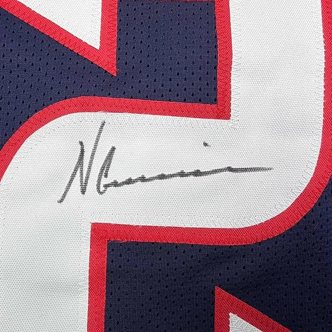 A navy blue white and red mesh basketball jersey signed by Nico Collins displayed in a framed 35x39 Houston rookie jersey
