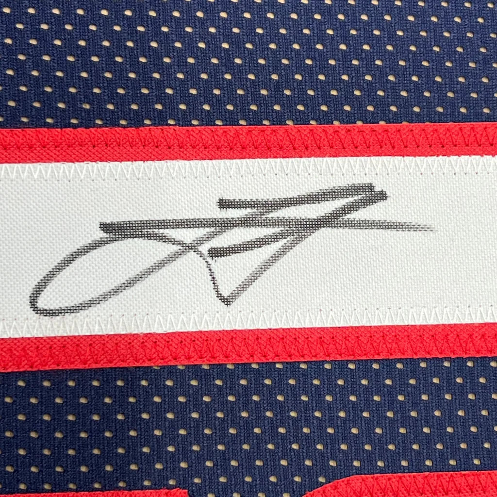 Framed signed Nikola Jokic Denver navy blue basketball jersey with black stitched signature on white stripe