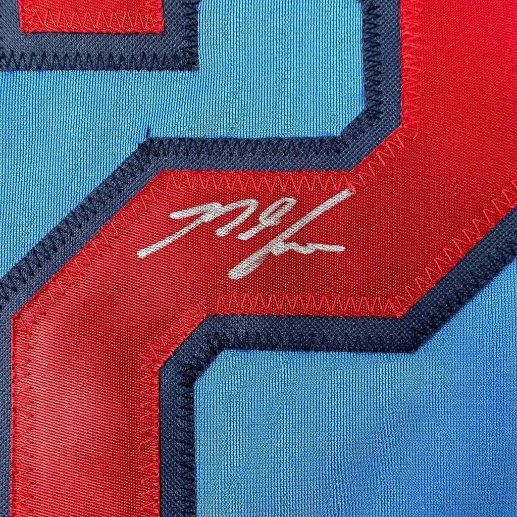 Light blue Nolan Arenado signed sports jersey with red and dark blue numbers for your man cave