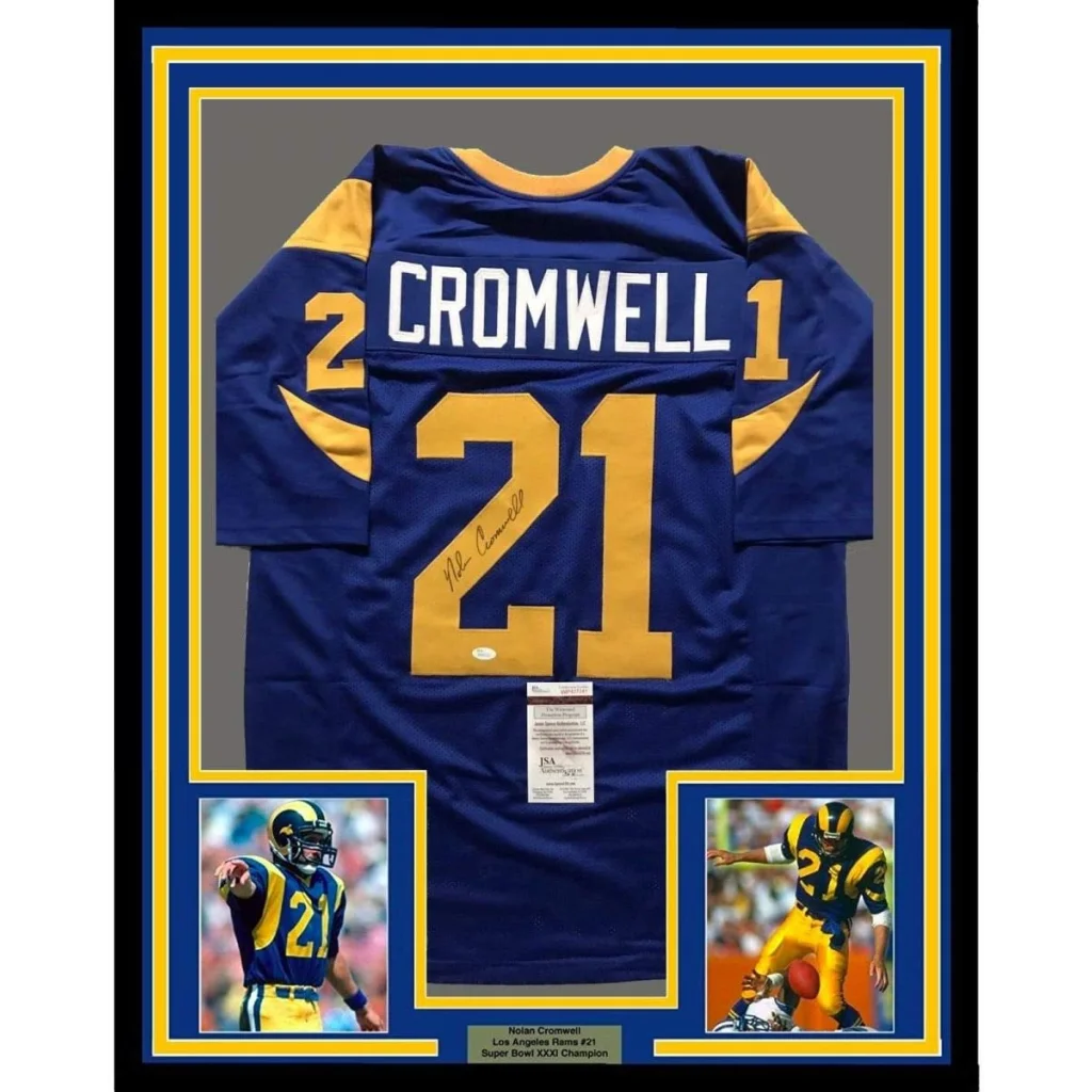 Framed autographed Nolan Cromwell blue LA Rams jersey with number 21