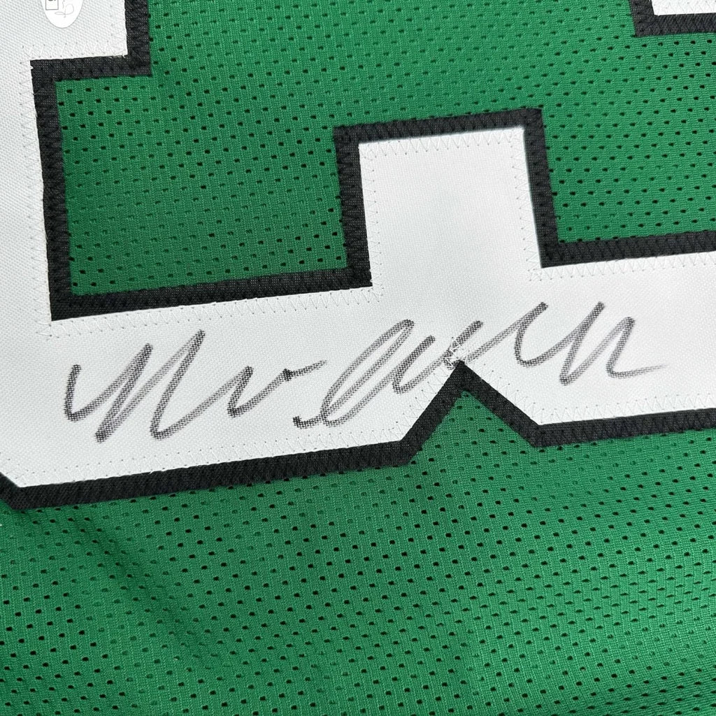Professionally framed Philadelphia Kelly Green football jersey with signature and black and white number