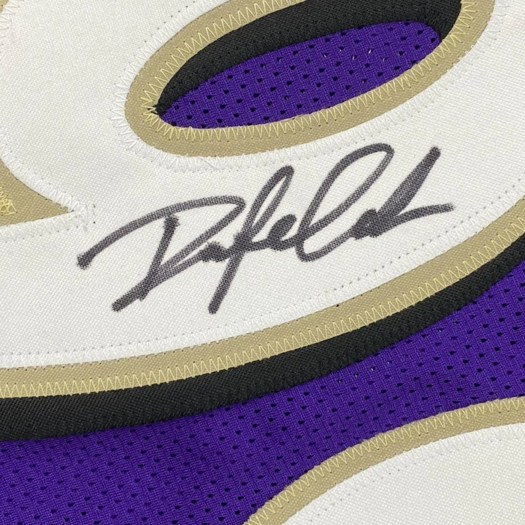 Framed autographed Baltimore Ravens purple jersey by Odafe Oweh with JSA COA