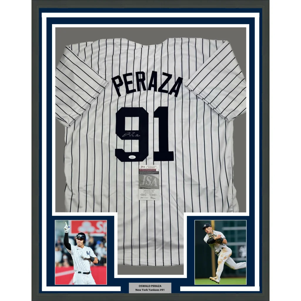 Framed Oswaldo Peraza Yankees jersey with autographs and player photos ready to hang