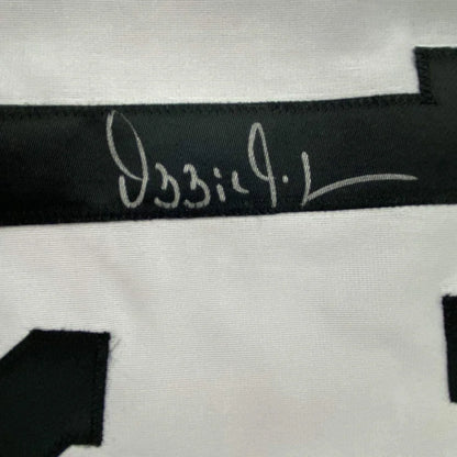 White Ozzie Guillen signed jersey with black trim and JSA COA for your man cave