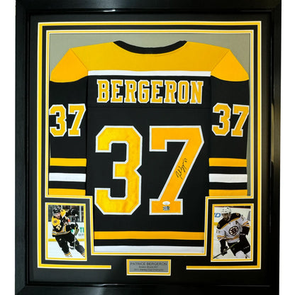 Framed autographed Patrice Bergeron black Boston Bruins jersey with number 37