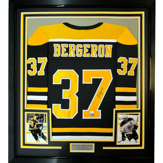 Framed autographed Patrice Bergeron black Boston Bruins jersey with number 37