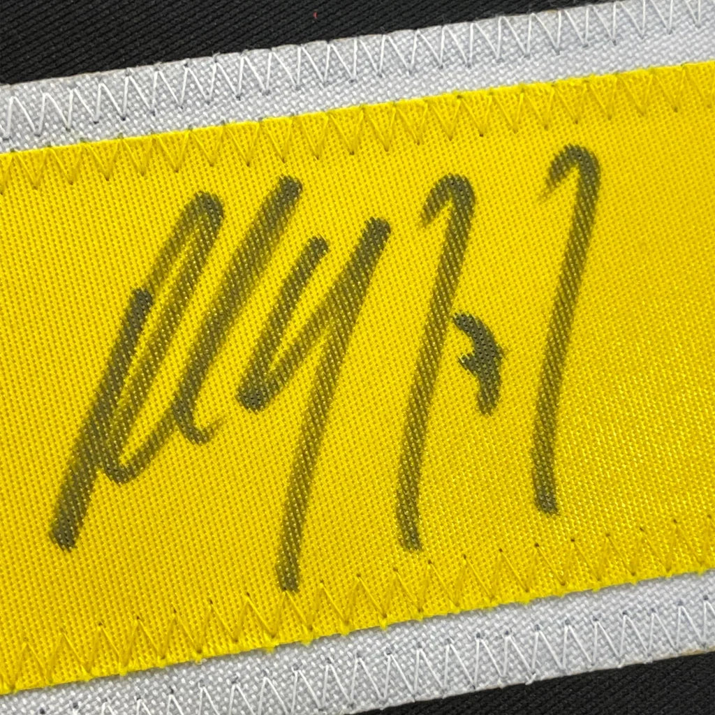 Yellow fabric strip with black marker writing from Paul Coffey hockey jersey for your man cave