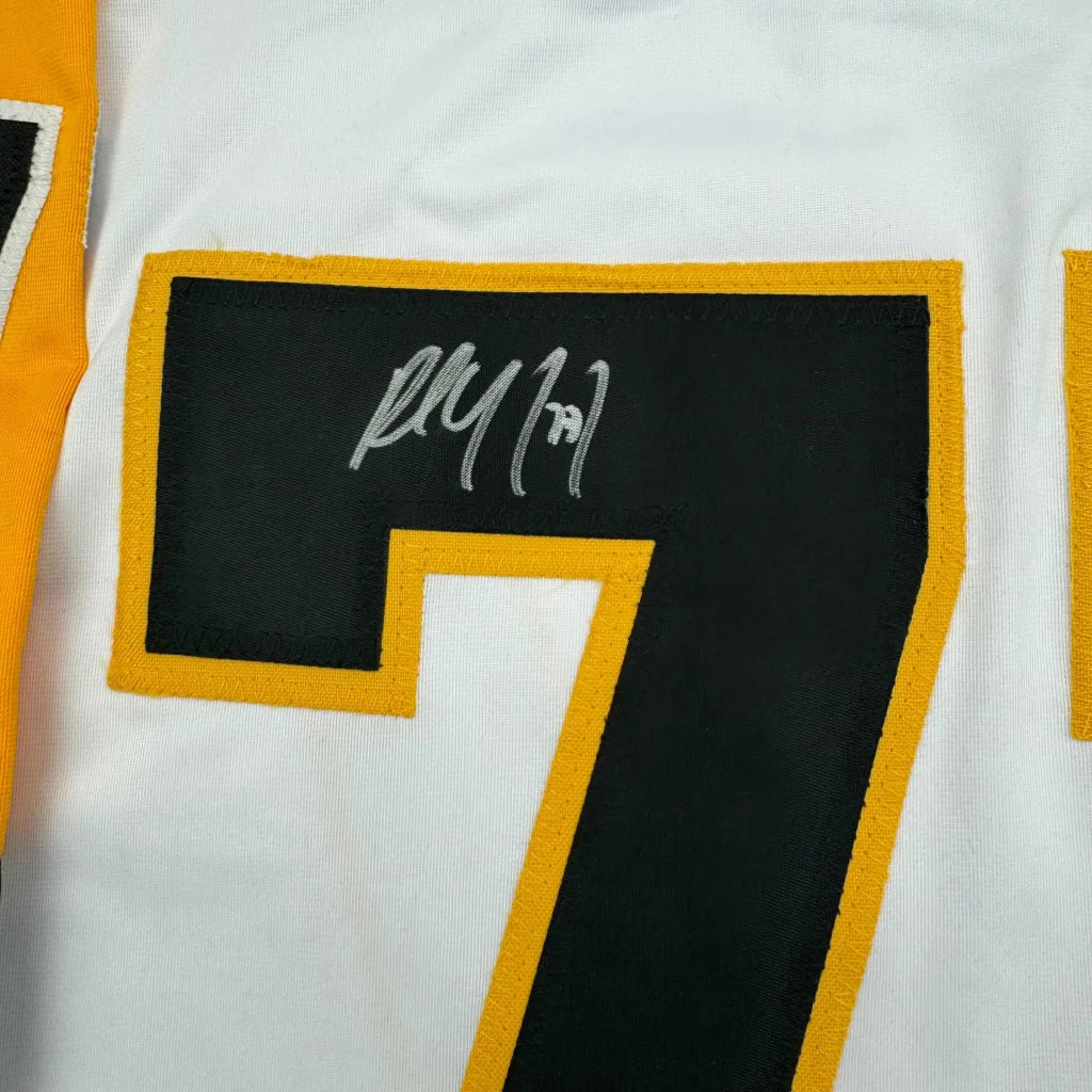 White framed autographed Paul Coffey Pittsburgh hockey jersey with bold black number 7 outlined in gold on back